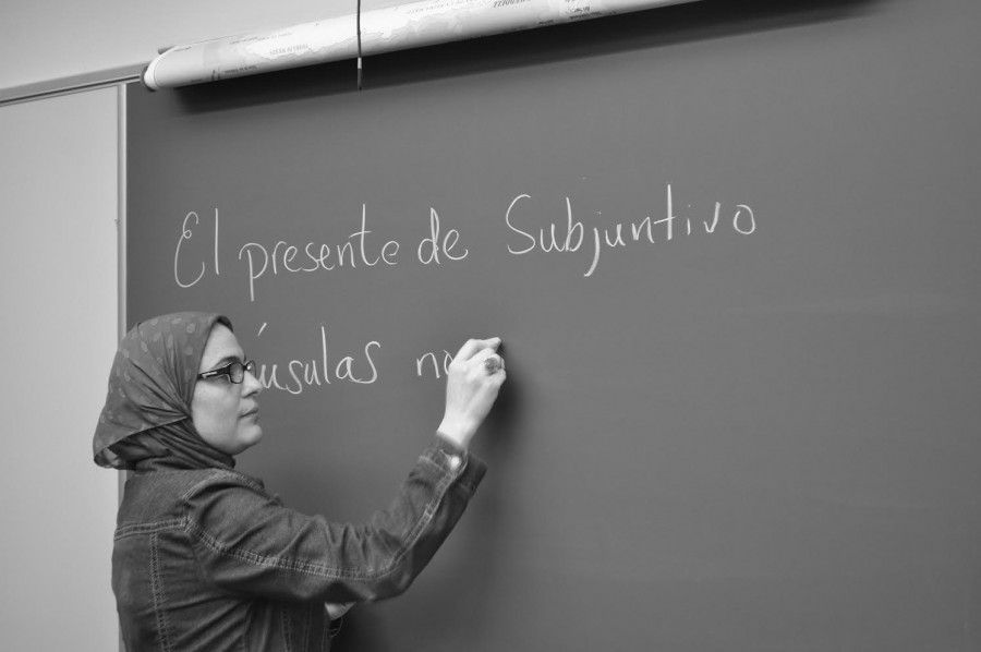 New Spanish teacher Coralie Sabir mimics her teaching style. 