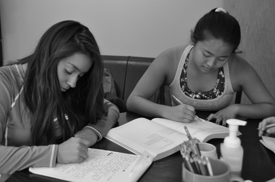 Priscilla Roman and Sonya Vaintrub study for multiple standardized tests.