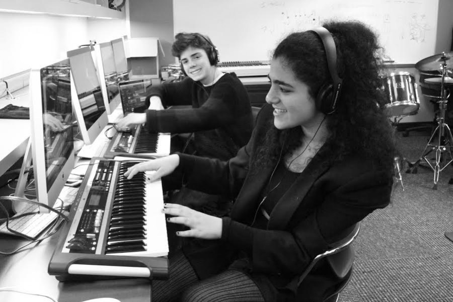 Eddie Burns (left) and Natasha Lerner (right) create music during their class.