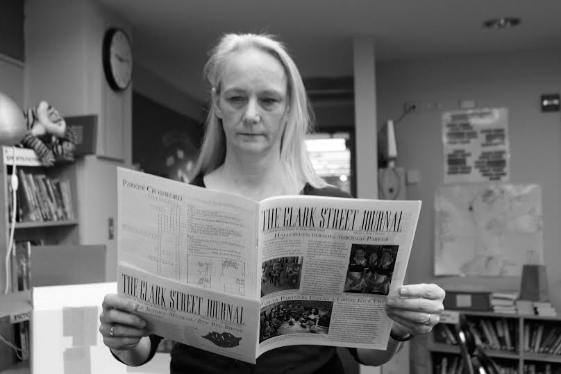 Faculty advisor, Kate Tabor, reviews the Clark Street Journal once more. 