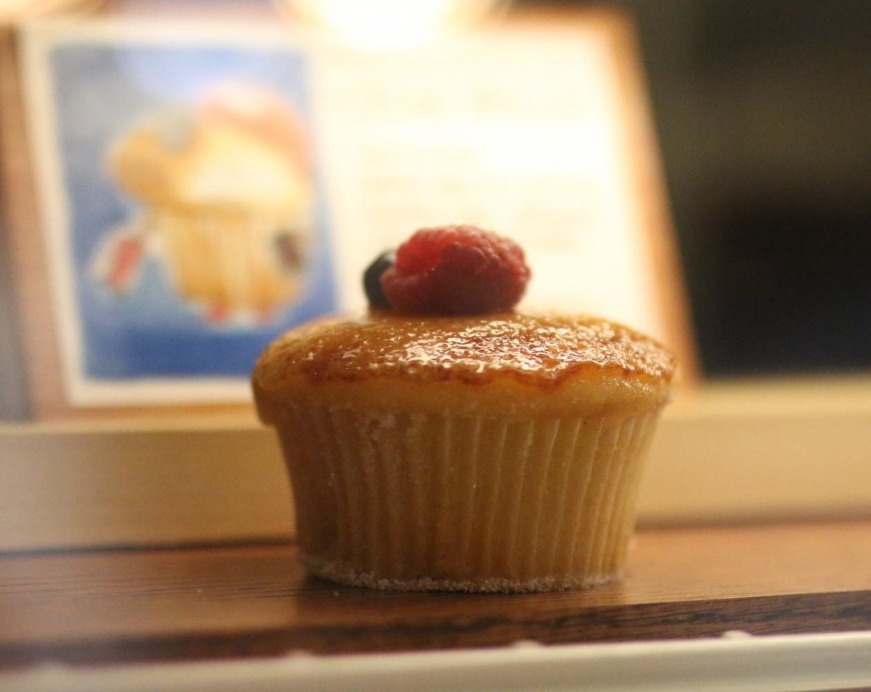 Behind each cupcake in the display case is a small, hand-drawn image which represents that specific variety of cupcake.
