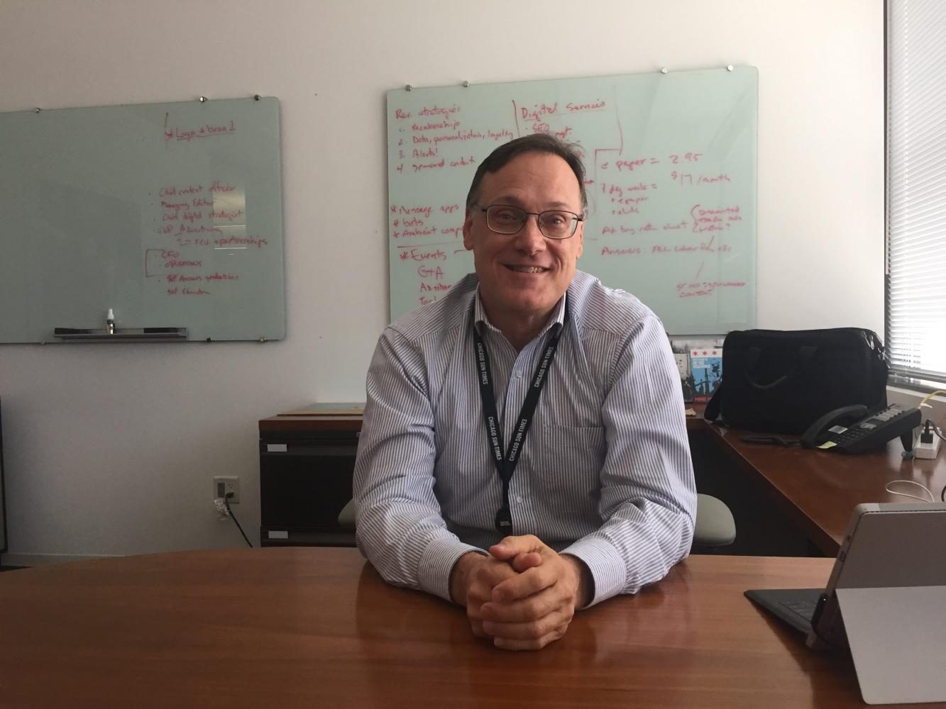 New Sun Times CEO and Parker Alum Edwin Eisendrath sits in his new office.