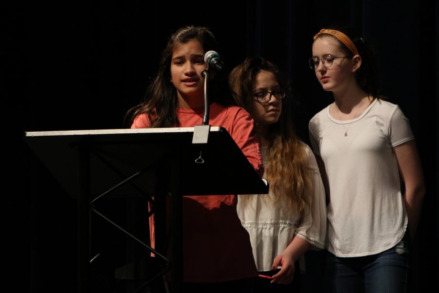 8th grade students speak at the opening Morning Exercise.