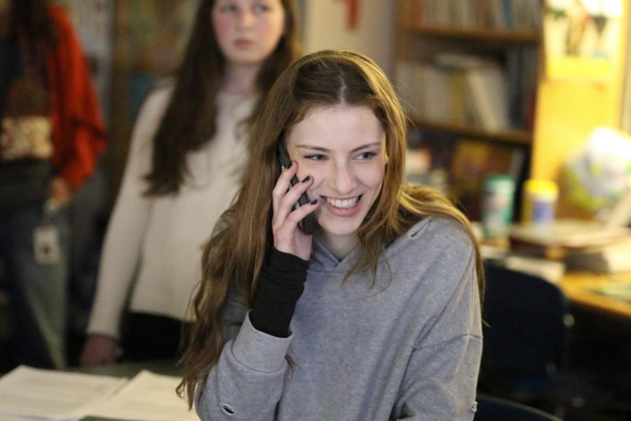 Sophomore Caroline Conforti makes phone calls to her elected representatives during a breakout session.