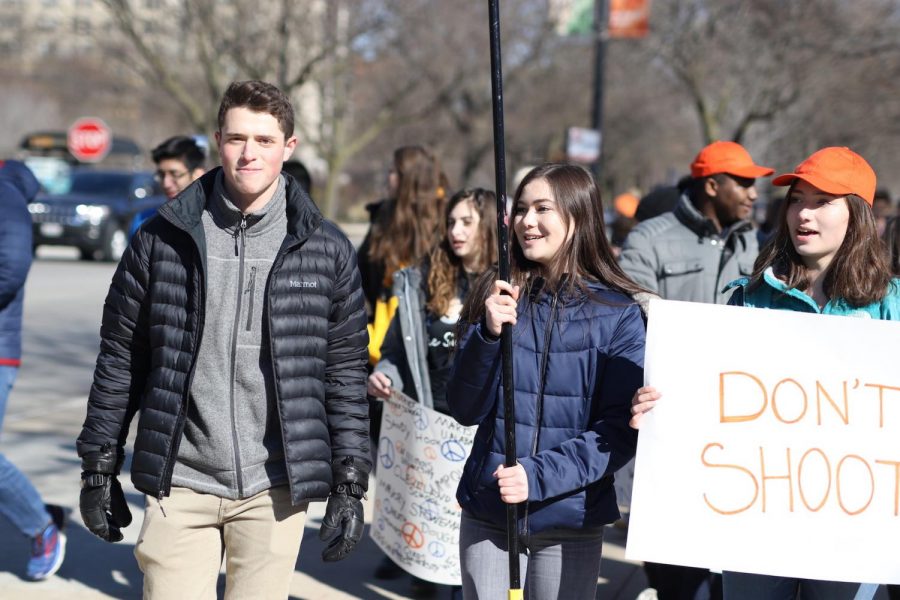Walkout+Student+Organizers+Sammy+Kagan+%28left%29%2C+Jenna+Mansueto+%28center%29%2C+and+Felicia+Miller+%28right%29+lead+students+to+the+rally+near+South+Pond.