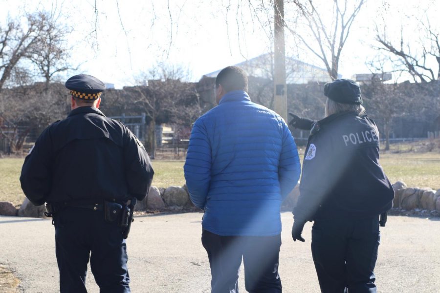 Upper School Head Justin Brandon (center) walks side-by-side with officers of the Chicago Police Department. Police officers were asked to attend the Walkout to ensure the safety of Parker students.