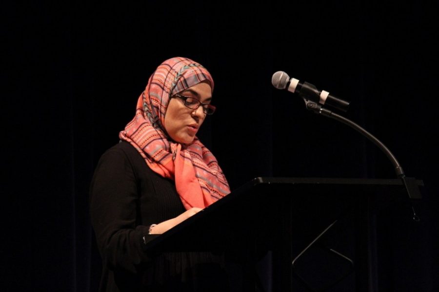 Upper school Spanish teacher Yadiner Sabir reads her section of She Persisted: 13 American Women Who Changed the World by Chelsea Clinton, which included the stories of Sonia Sotomayor and Nellie Bly.
