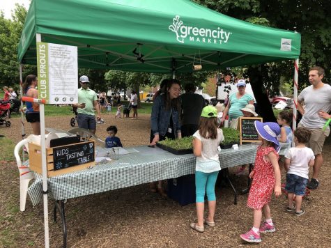 Kids try microgreens from Nichol’s Farm at Green City’s Club Sprouts tent, a part of the Market’s education initiative, on a recent Saturday.