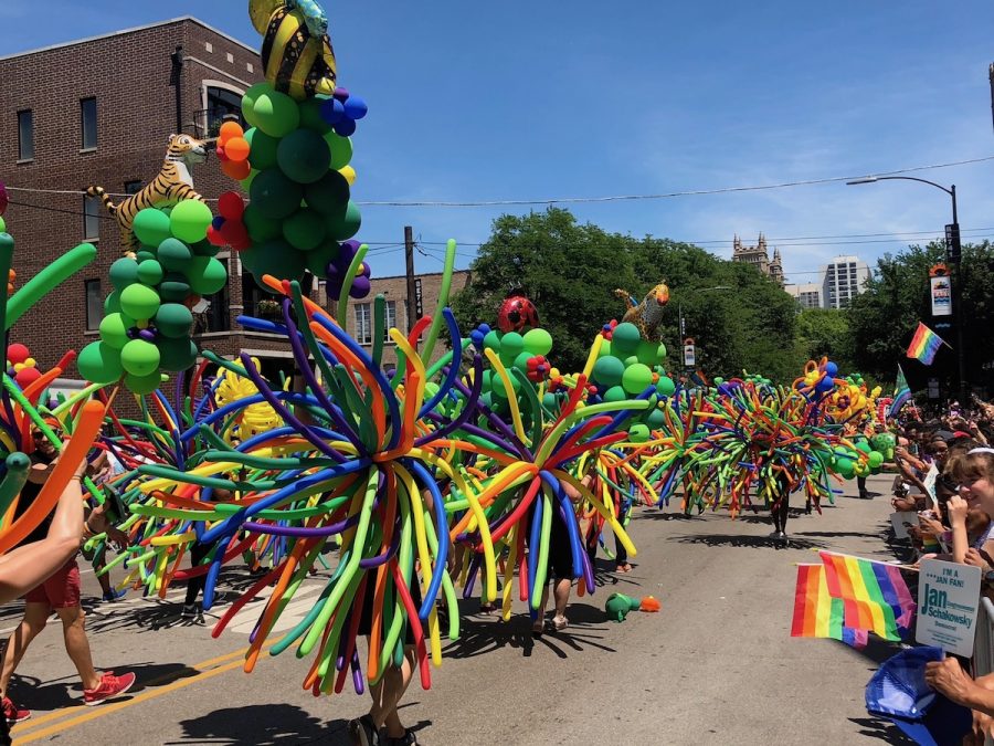 Colorful arrays of balloons line the streets and delight onlookers at the 2018 annual Pride Parade.
