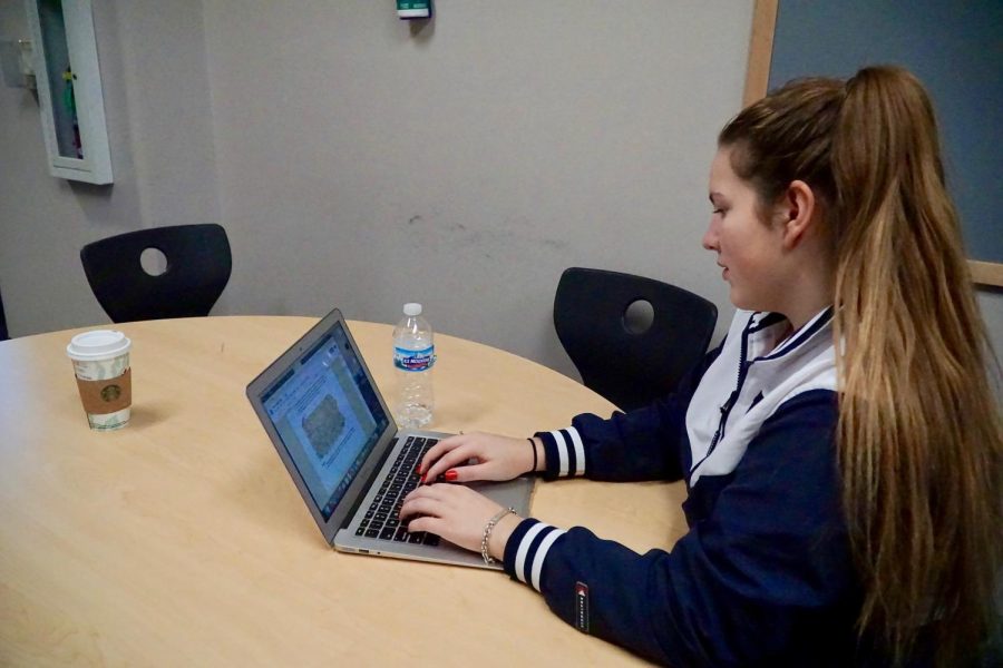 Student Celeste Gerbaulet-Vanasse working on her in-class essay for history.