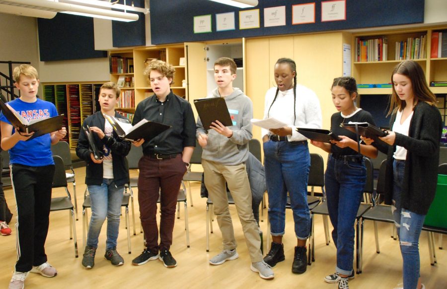 Members of Grape Jam, Jack Bowers (left), Ryan Toulouse, Will Ehrlich, Jared Saef, Arie King something, Sage Holt-Hall, and Ivy Jacobs (right), practicing songs for a music festival on February 1st.