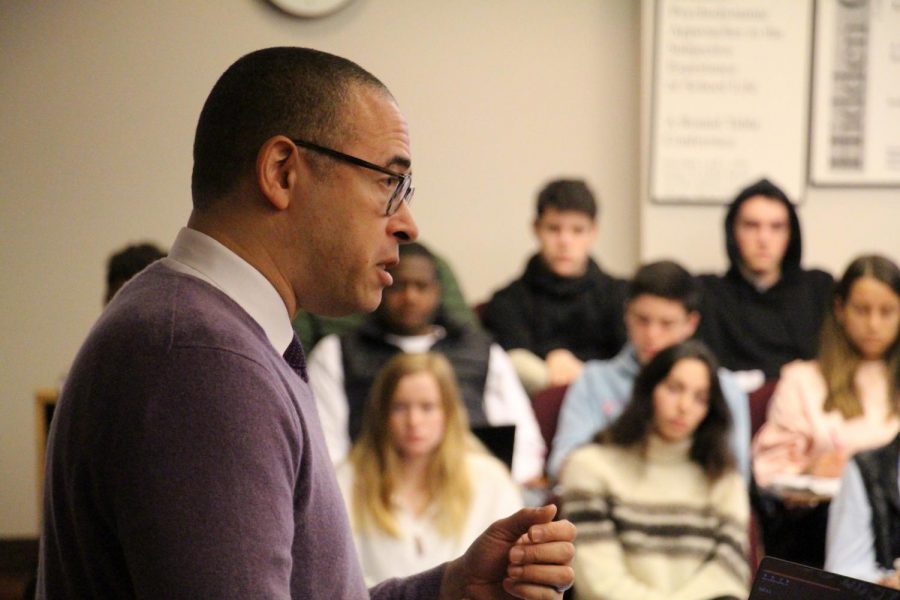 Dr. Jonathan Holloway lectures students in the Harris Center as part of their American History Curriculum. Photo courtesy of Nick Saracino.