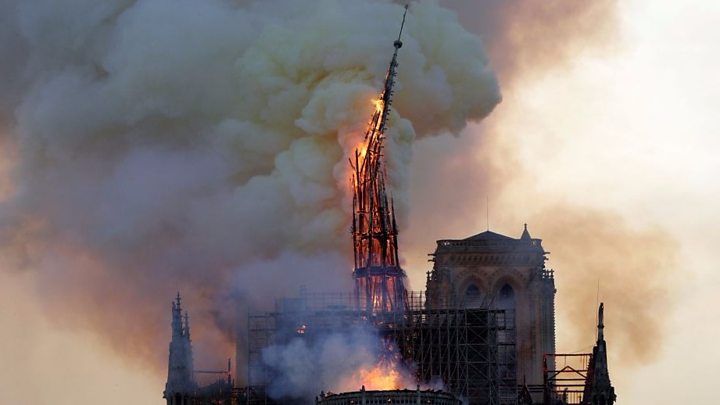 The spire on Paris Notre Dame cathedral falls. Photo courtesy of the BBC.