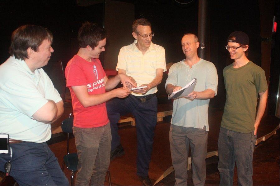 David Alex works with the cast on the play “Adrift.” Photo courtesy of The Daily Herald.
