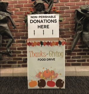 A box sits in the front alcove, encouraging donations to the food drive