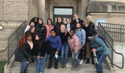 Students pose outside of the Greater Bethesda Missionary Baptist Church after the Social Justice and Envi- ronmental Committee trash pick up in Washington Park.