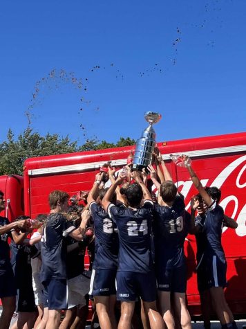 Varsity Soccer players participate in a Coca-Cola spray down after winning the championship of the Body Armor Series.
