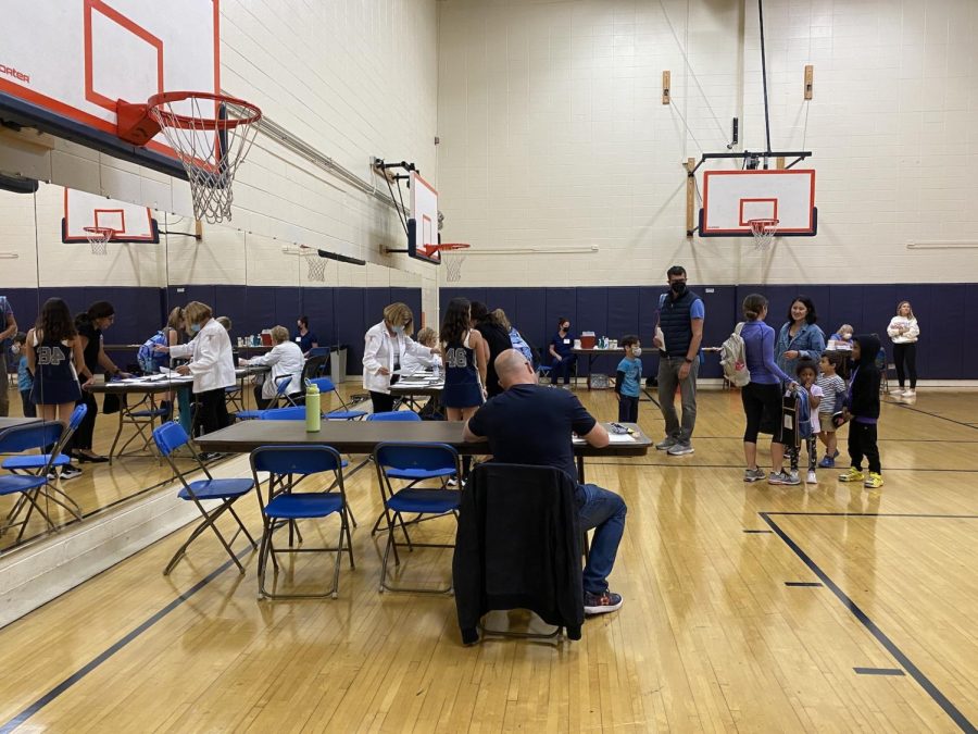 Parker community members gather in the small gym for the annual flu vaccine clinic.