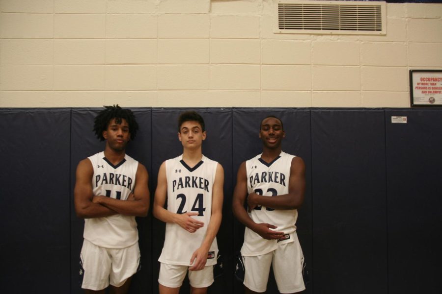The Boys Basketball varsity captains Payton Pitts, Owen Stepan and Caleb David pose for a photo.
