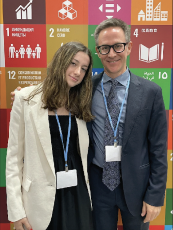 Julia Peet and her father pose for a photo at COP27.