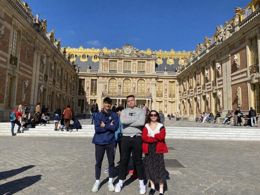 Juniors Marian Cozma, Sam Forst and Senior Litzy Tafolla outside
of the Castle of Versailles.