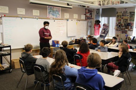 Visiting Poet Julian Randall ’11 speaks to a 5th grade class.