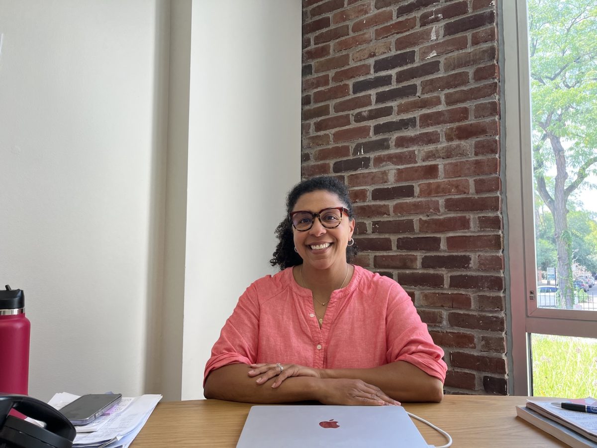 Director of Diversity, Equity, Inclusion, and Belonging Erika Prahl sits in her office.