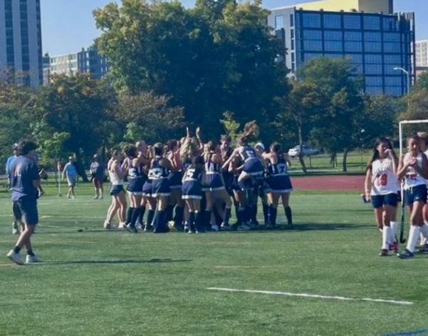 Varsity Field Hockey celebrates after a 2-1 victory in Latin Homecoming game.