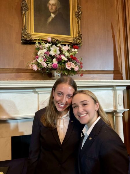 Junior Sloane Demitriou (left) with Lauren, a page from West Virginia at their Senate Page graduation in the Capitols Mansfield room in January.