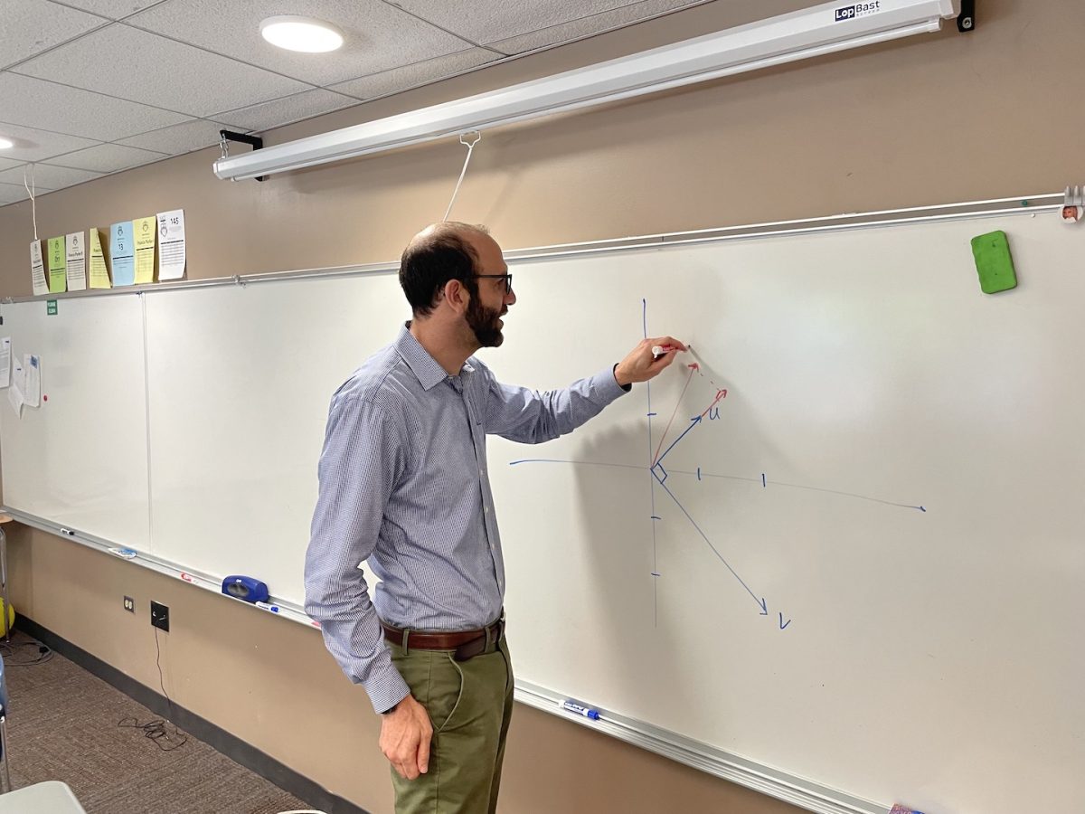 Ethan Levine draws diagram of precalculus concept on a
white board in his room.