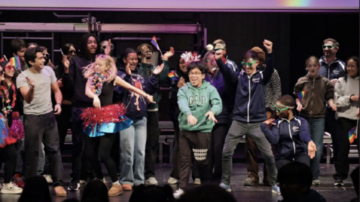 High schoolers and teachers dance together during the final lip sync song.