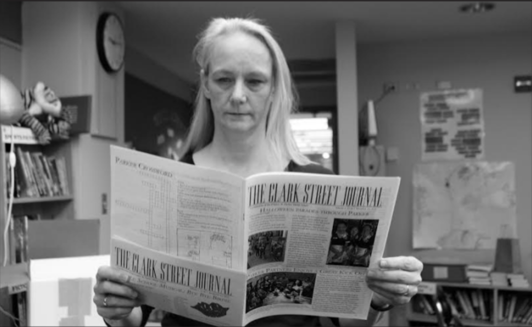 Kate Tabor holds a copy of Middle School Publication